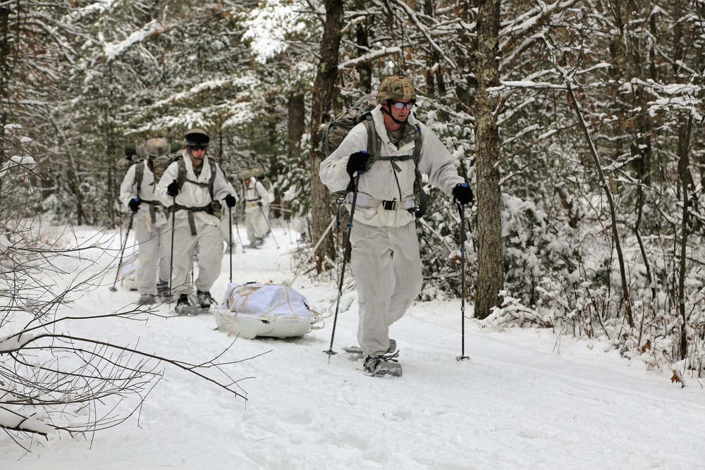 Cold-Weather Operations Course Class 18-06 students practice snowshoeing at Fort McCoy