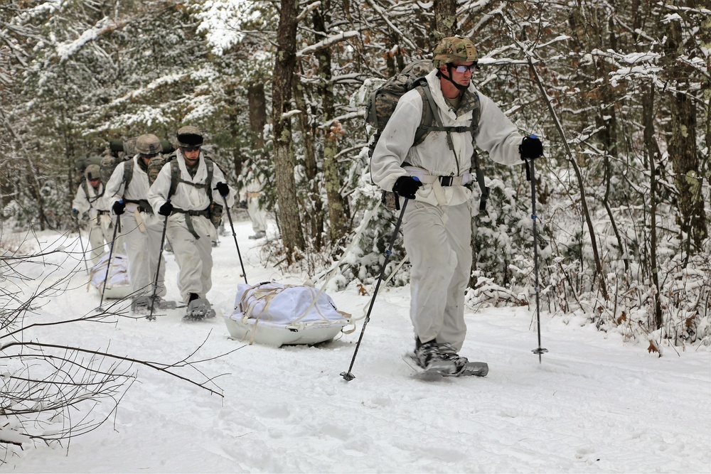 Cold-Weather Operations Course Class 18-06 students practice snowshoeing at Fort McCoy