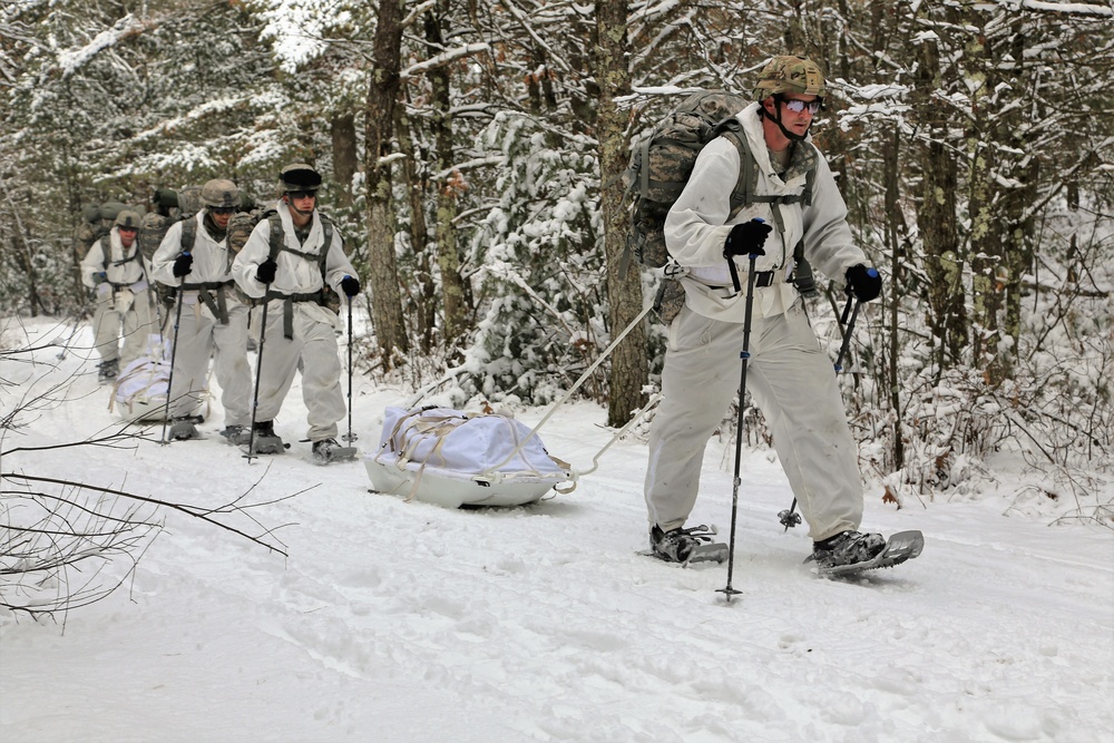 Cold-Weather Operations Course Class 18-06 students practice snowshoeing at Fort McCoy