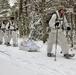 Cold-Weather Operations Course Class 18-06 students practice snowshoeing at Fort McCoy