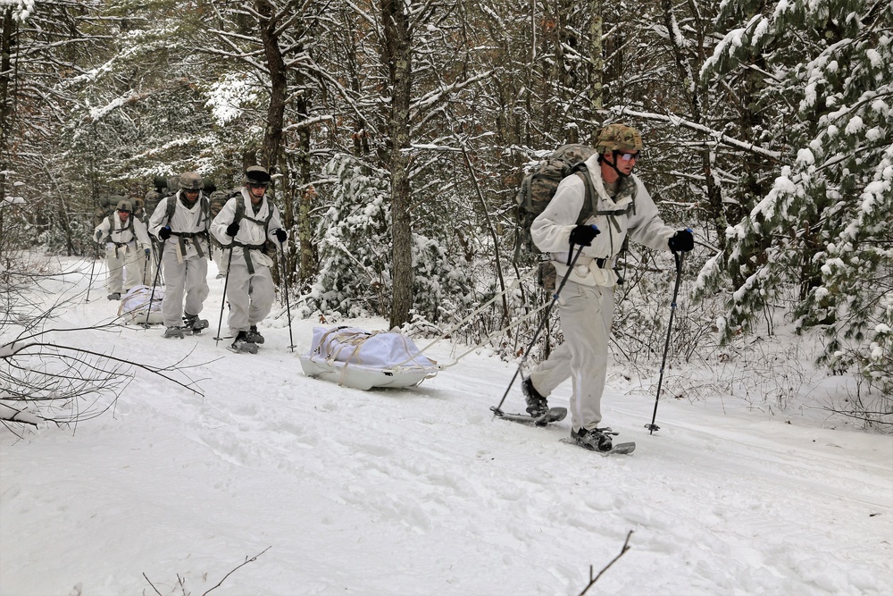 Cold-Weather Operations Course Class 18-06 students practice snowshoeing at Fort McCoy