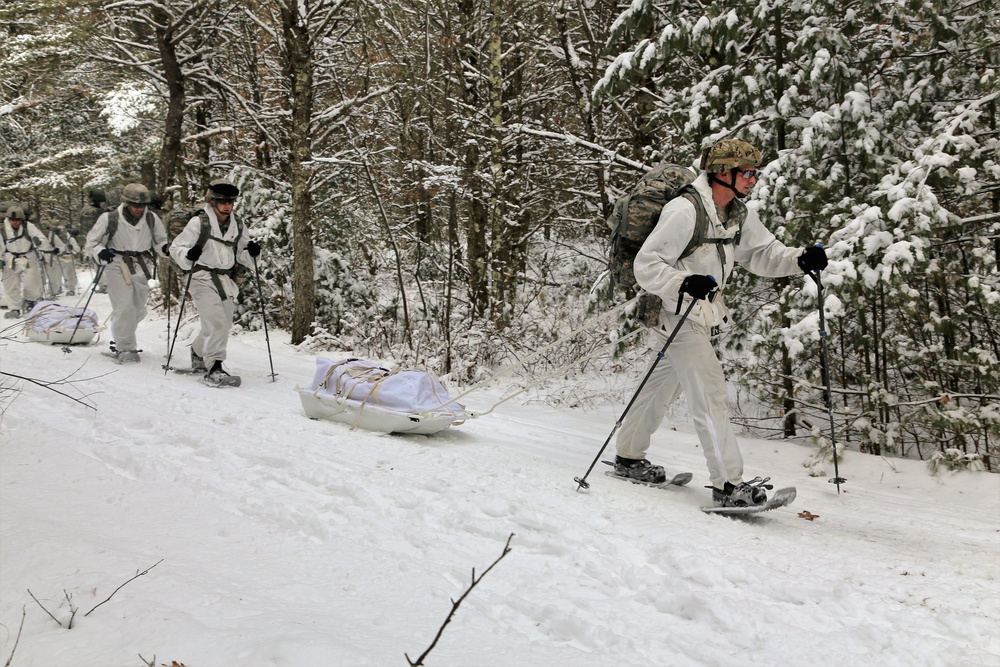 Cold-Weather Operations Course Class 18-06 students practice snowshoeing at Fort McCoy