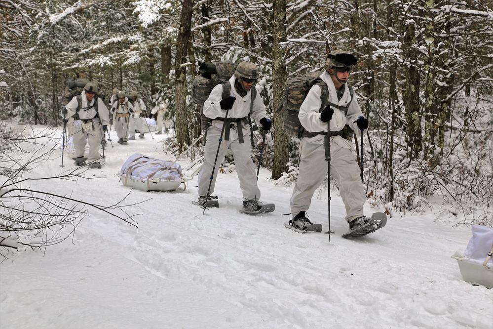 Cold-Weather Operations Course Class 18-06 students practice snowshoeing at Fort McCoy