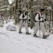 Cold-Weather Operations Course Class 18-06 students practice snowshoeing at Fort McCoy