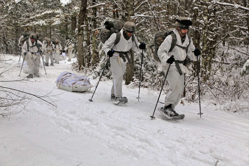 Cold-Weather Operations Course Class 18-06 students practice snowshoeing at Fort McCoy