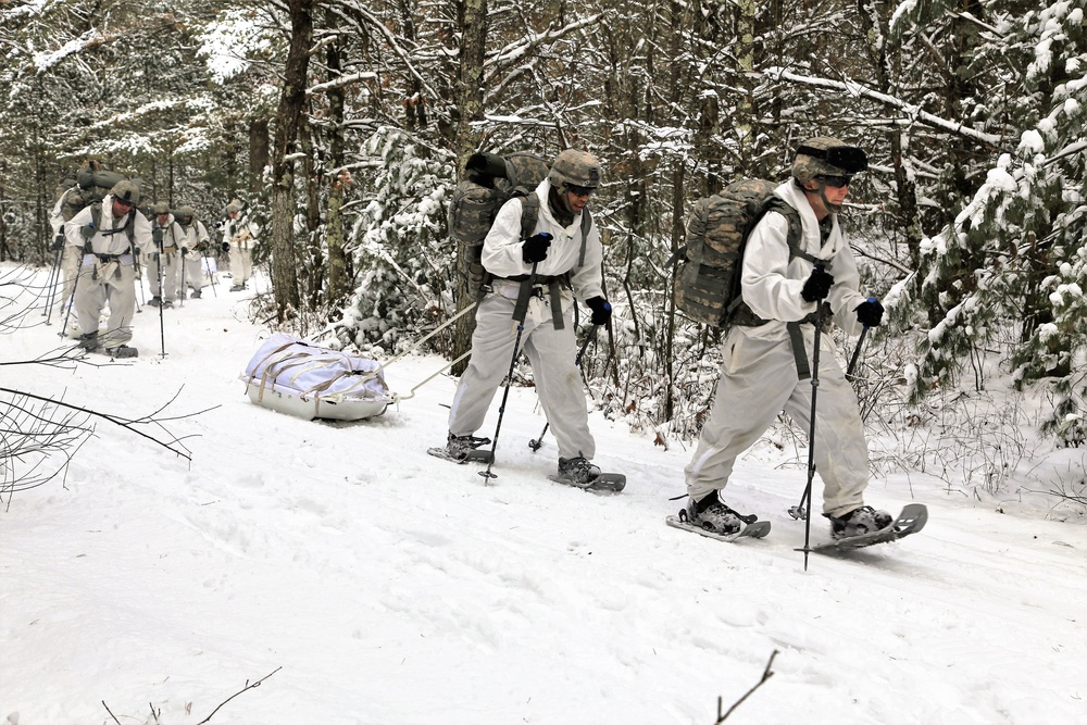 Cold-Weather Operations Course Class 18-06 students practice snowshoeing at Fort McCoy