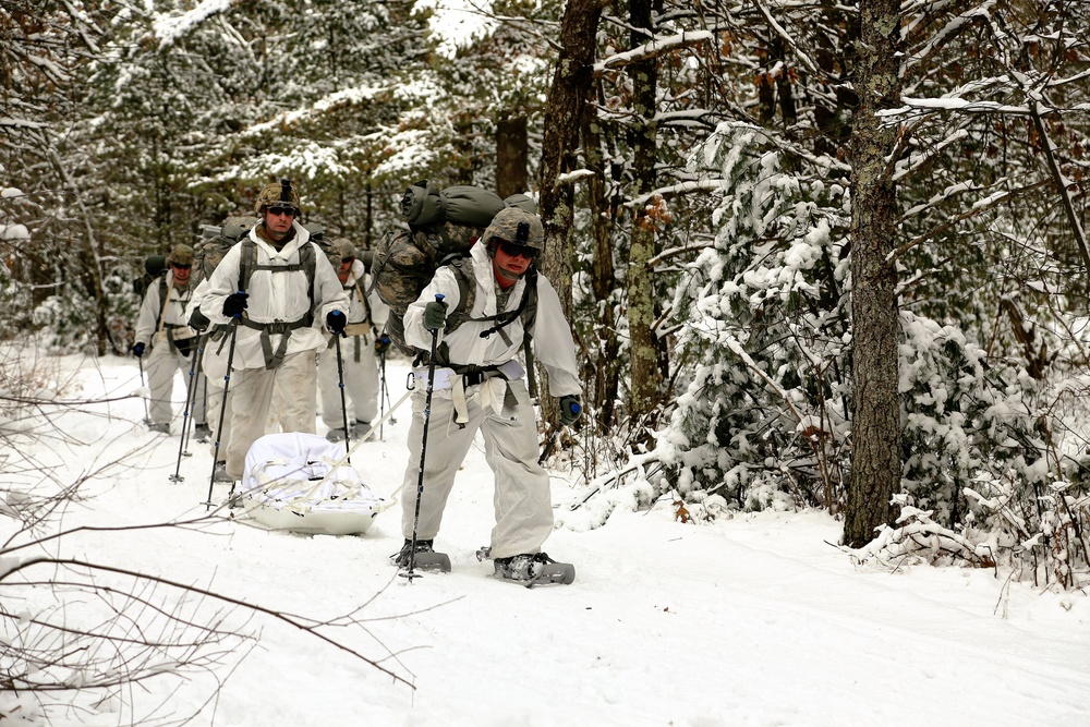 Cold-Weather Operations Course Class 18-06 students practice snowshoeing at Fort McCoy