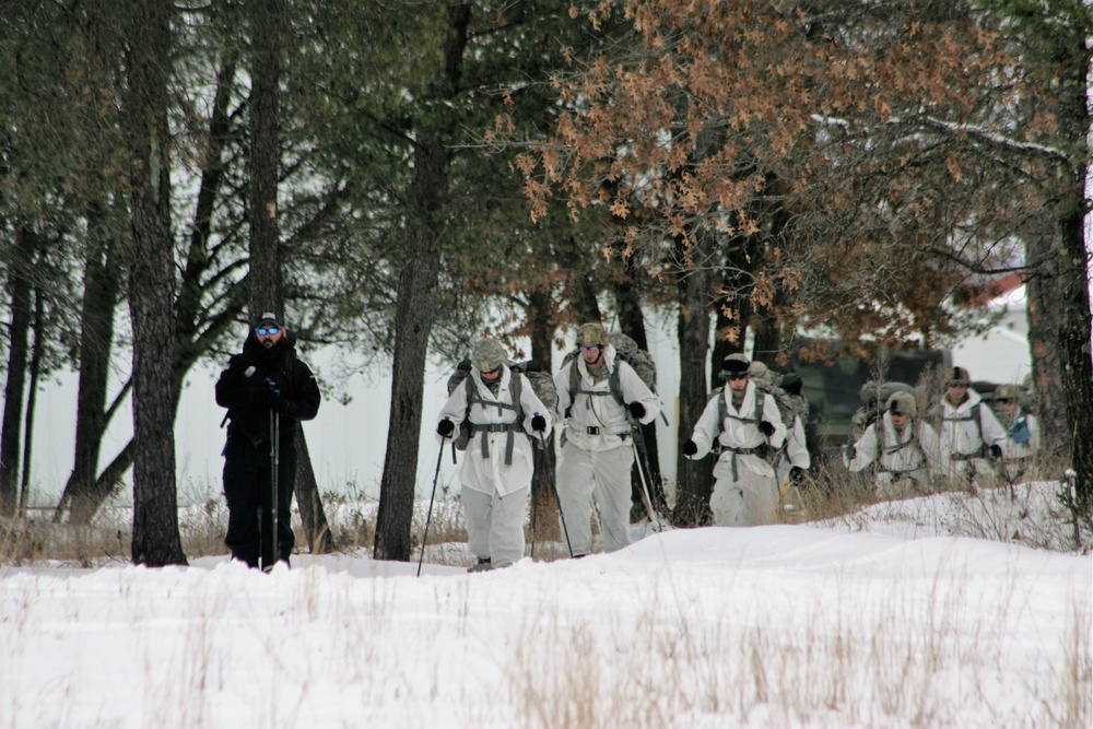 Cold-Weather Operations Course Class 18-06 students practice snowshoeing at Fort McCoy