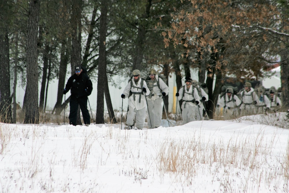 Cold-Weather Operations Course Class 18-06 students practice snowshoeing at Fort McCoy