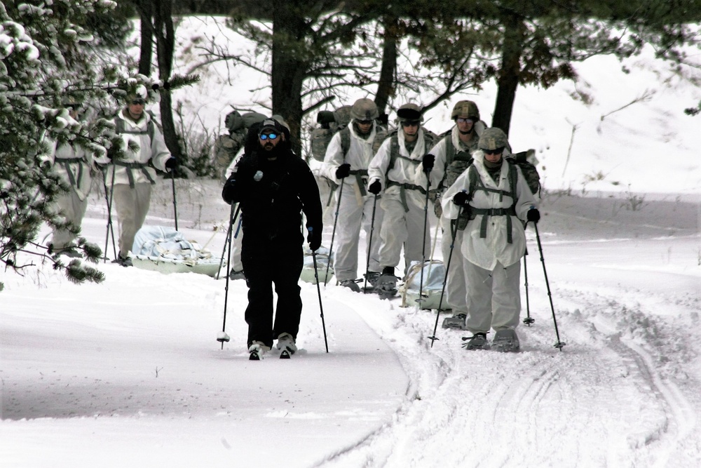 Cold-Weather Operations Course Class 18-06 students practice snowshoeing at Fort McCoy