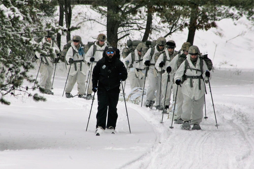 Cold-Weather Operations Course Class 18-06 students practice snowshoeing at Fort McCoy