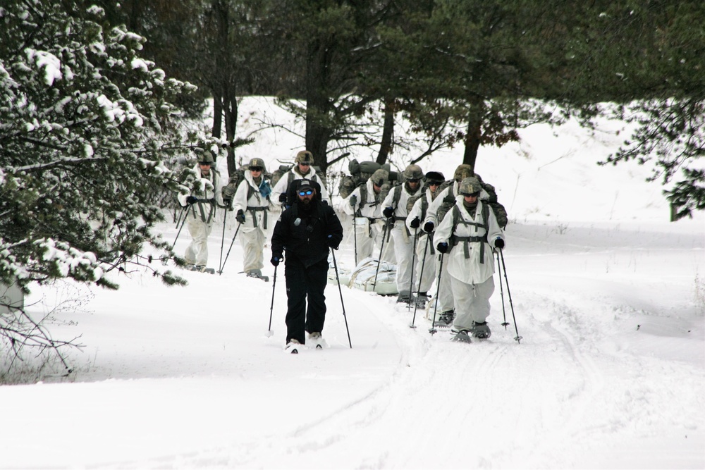 Cold-Weather Operations Course Class 18-06 students practice snowshoeing at Fort McCoy