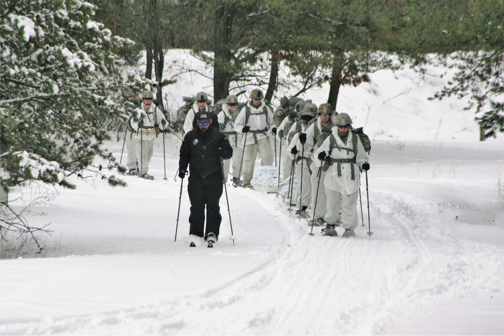 Cold-Weather Operations Course Class 18-06 students practice snowshoeing at Fort McCoy