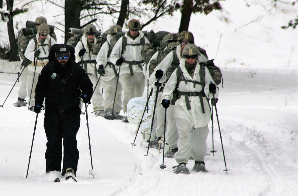 Cold-Weather Operations Course Class 18-06 students practice snowshoeing at Fort McCoy