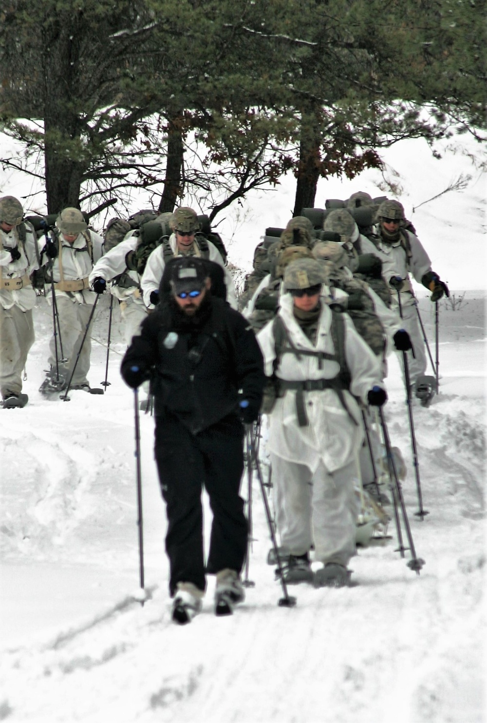 Cold-Weather Operations Course Class 18-06 students practice snowshoeing at Fort McCoy