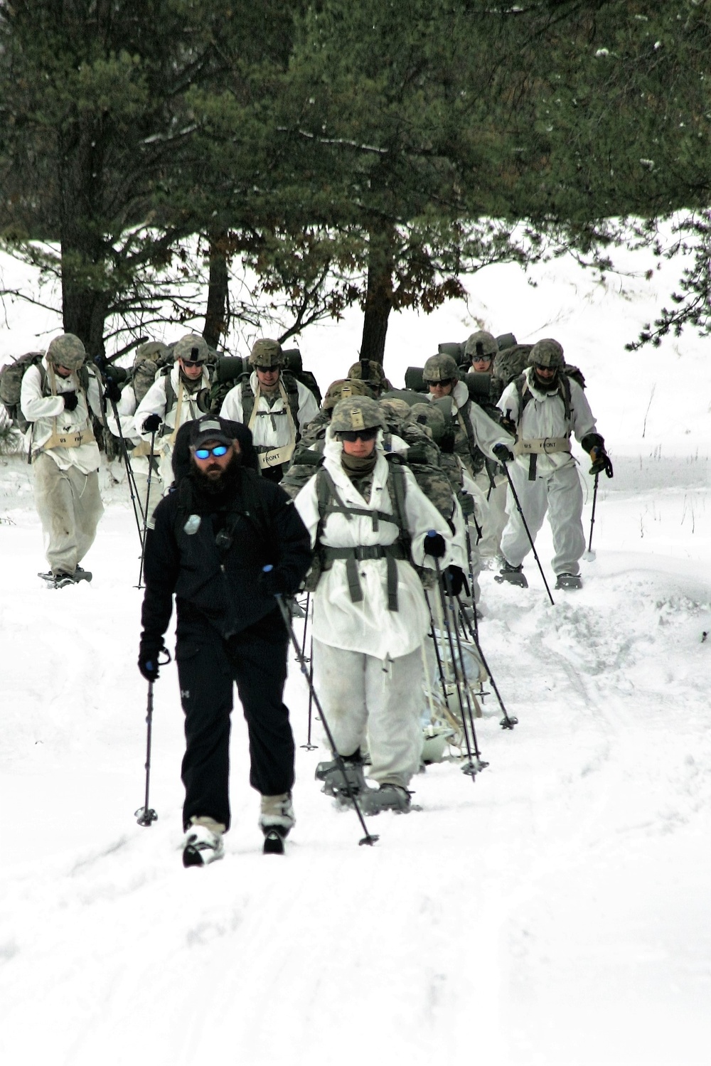 Cold-Weather Operations Course Class 18-06 students practice snowshoeing at Fort McCoy