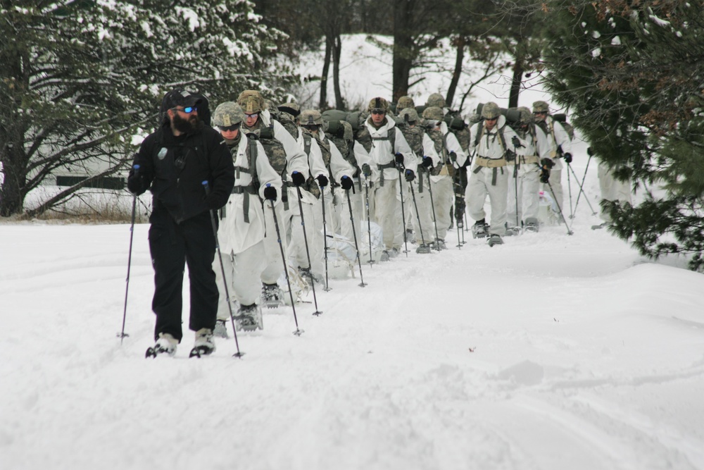 Cold-Weather Operations Course Class 18-06 students practice snowshoeing at Fort McCoy