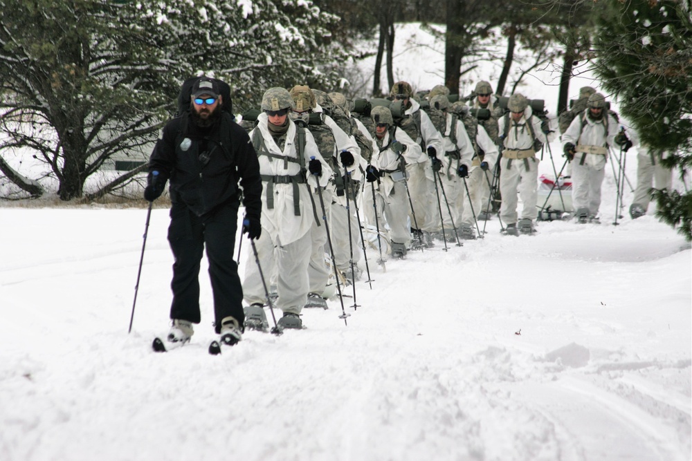 Cold-Weather Operations Course Class 18-06 students practice snowshoeing at Fort McCoy