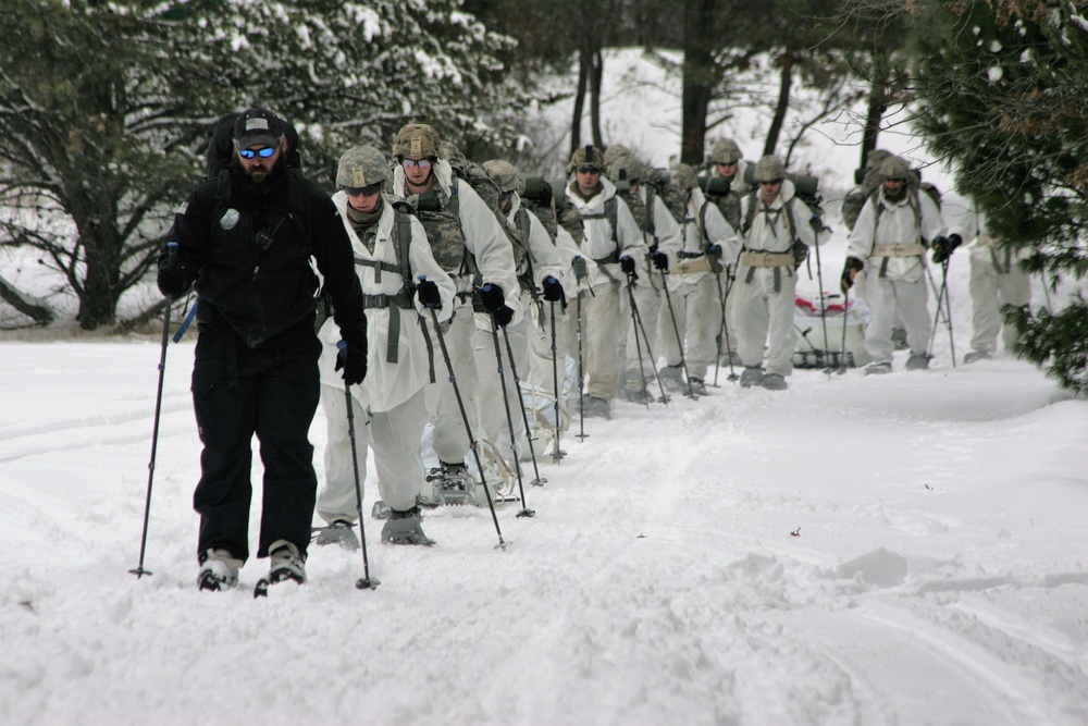 Cold-Weather Operations Course Class 18-06 students practice snowshoeing at Fort McCoy