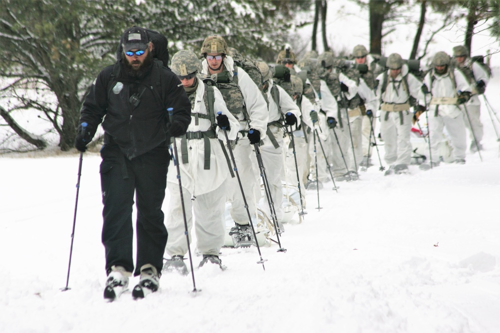 Cold-Weather Operations Course Class 18-06 students practice snowshoeing at Fort McCoy