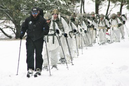 Cold-Weather Operations Course Class 18-06 students practice snowshoeing at Fort McCoy