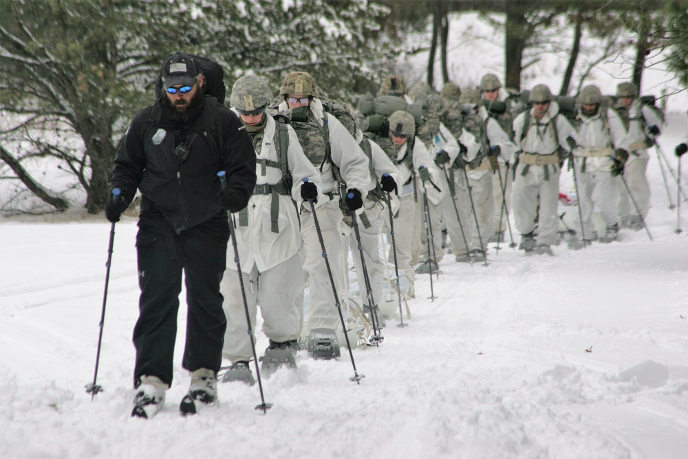 Cold-Weather Operations Course Class 18-06 students practice snowshoeing at Fort McCoy