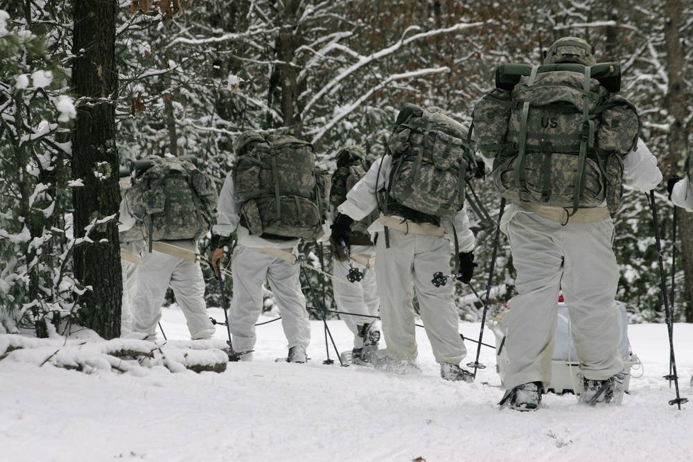 Cold-Weather Operations Course Class 18-06 students practice snowshoeing at Fort McCoy