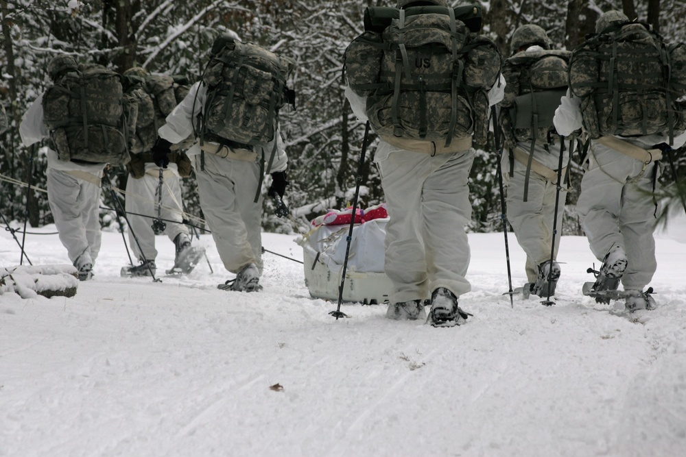 Cold-Weather Operations Course Class 18-06 students practice snowshoeing at Fort McCoy