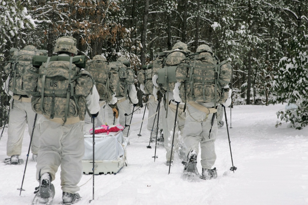 Cold-Weather Operations Course Class 18-06 students practice snowshoeing at Fort McCoy