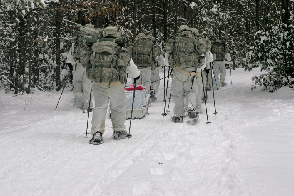 Cold-Weather Operations Course Class 18-06 students practice snowshoeing at Fort McCoy