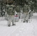 Cold-Weather Operations Course Class 18-06 students practice snowshoeing at Fort McCoy