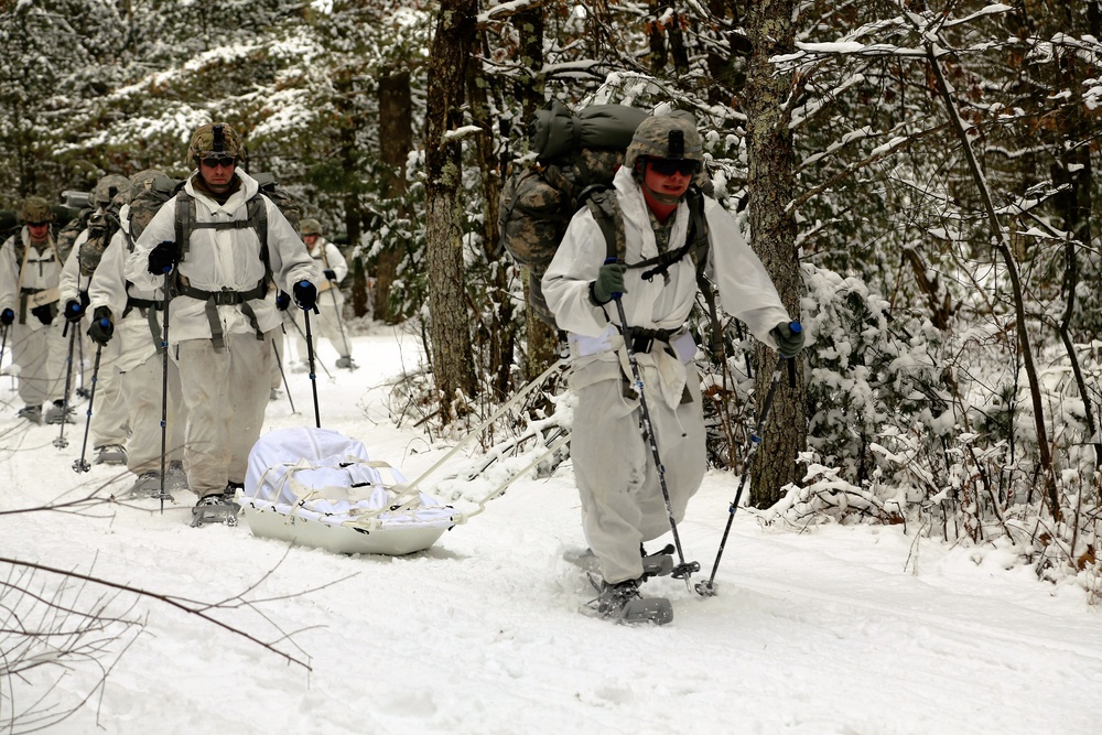 Cold-Weather Operations Course Class 18-06 students practice snowshoeing at Fort McCoy