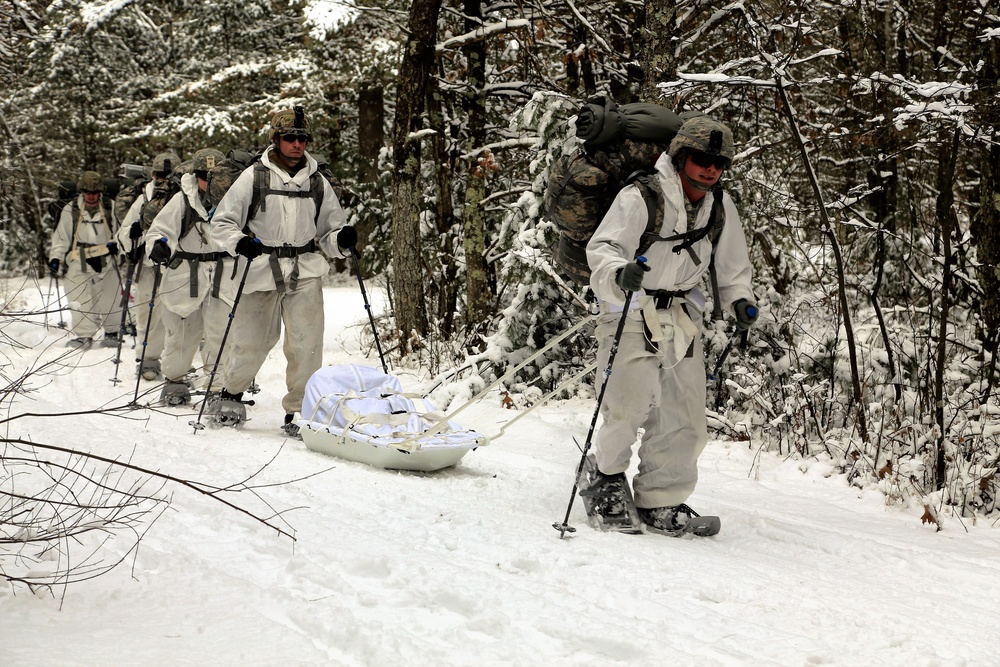 Cold-Weather Operations Course Class 18-06 students practice snowshoeing at Fort McCoy