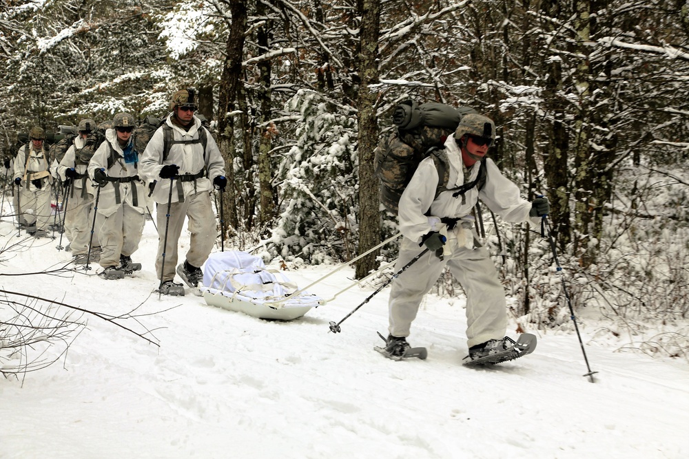 Cold-Weather Operations Course Class 18-06 students practice snowshoeing at Fort McCoy