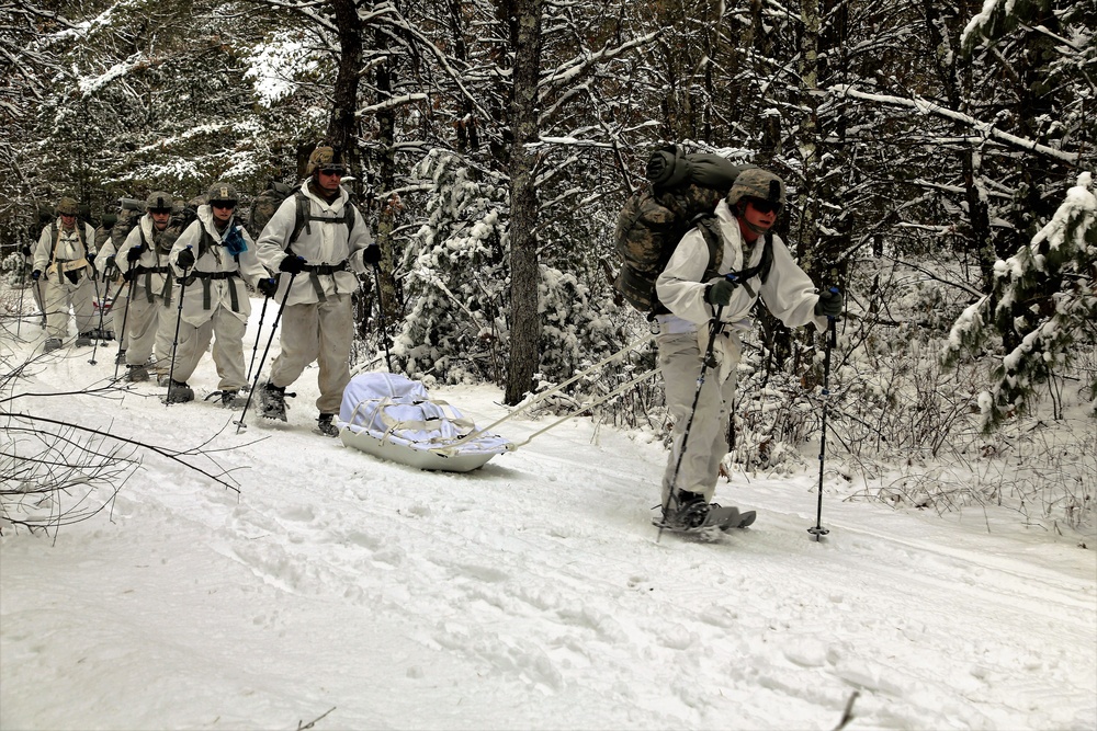 Cold-Weather Operations Course Class 18-06 students practice snowshoeing at Fort McCoy