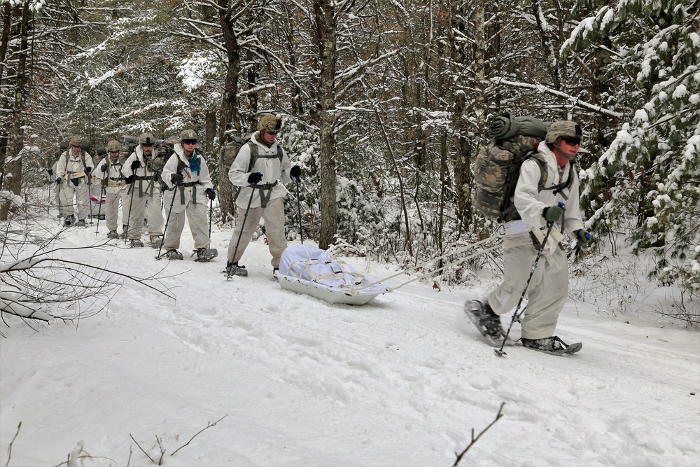 Cold-Weather Operations Course Class 18-06 students practice snowshoeing at Fort McCoy