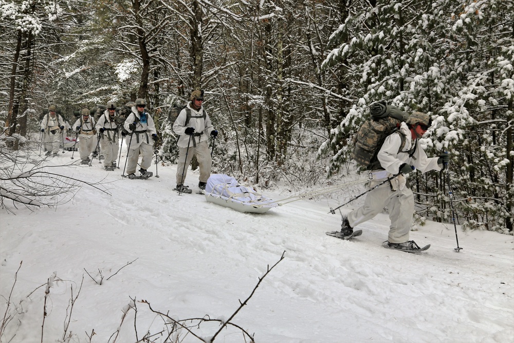 Cold-Weather Operations Course Class 18-06 students practice snowshoeing at Fort McCoy