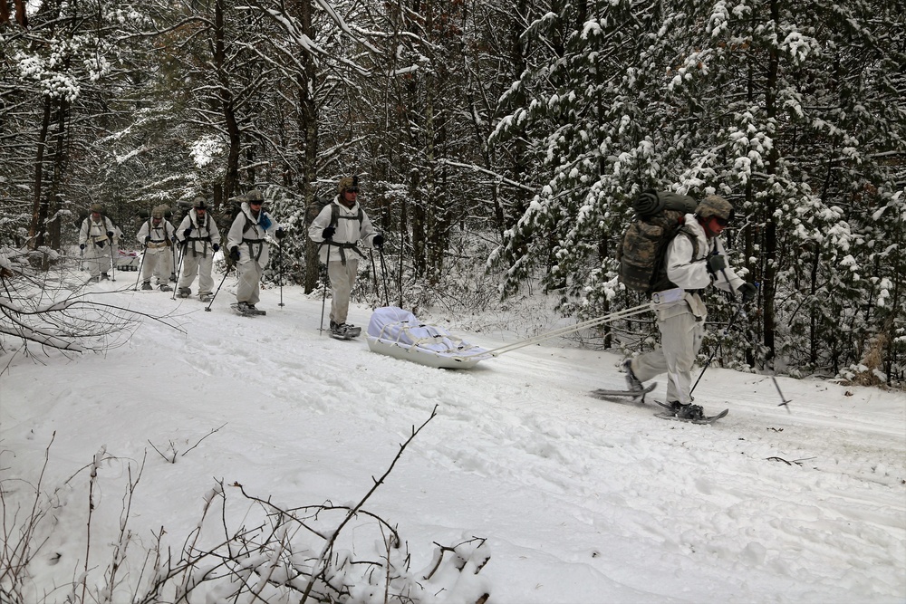 Cold-Weather Operations Course Class 18-06 students practice snowshoeing at Fort McCoy