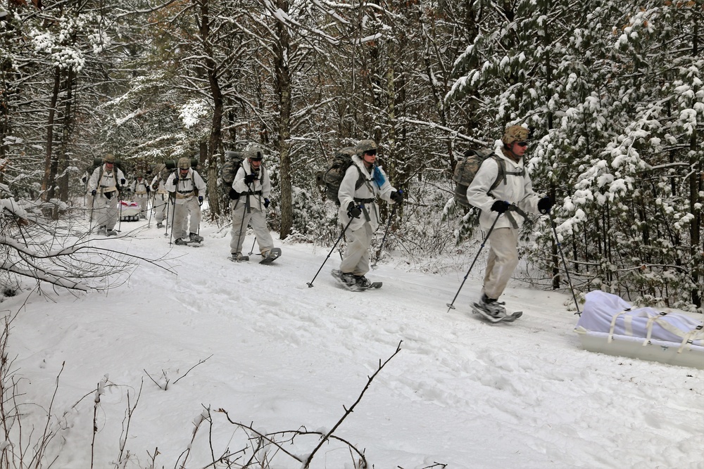 Cold-Weather Operations Course Class 18-06 students practice snowshoeing at Fort McCoy