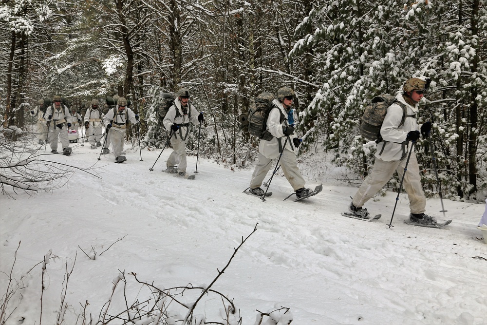 Cold-Weather Operations Course Class 18-06 students practice snowshoeing at Fort McCoy