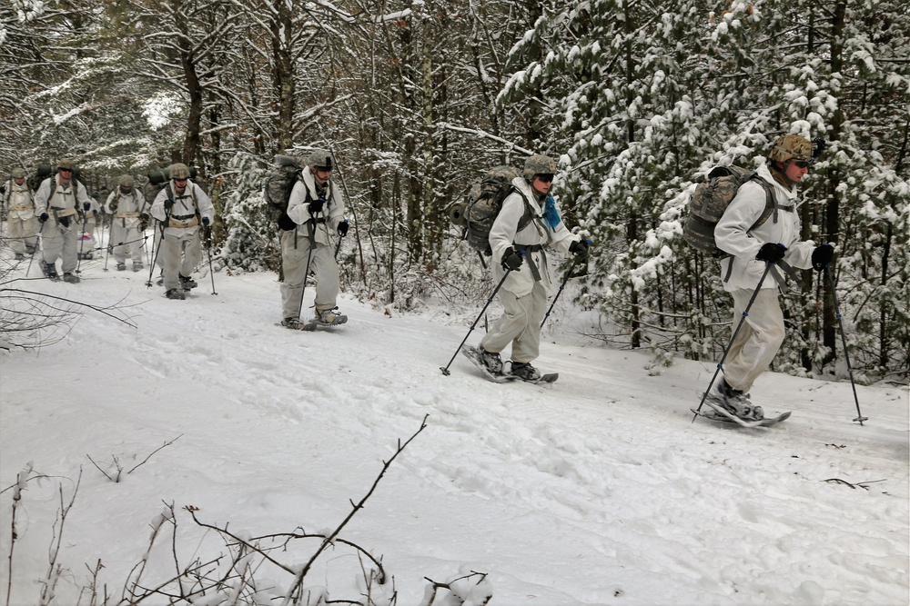 Cold-Weather Operations Course Class 18-06 students practice snowshoeing at Fort McCoy