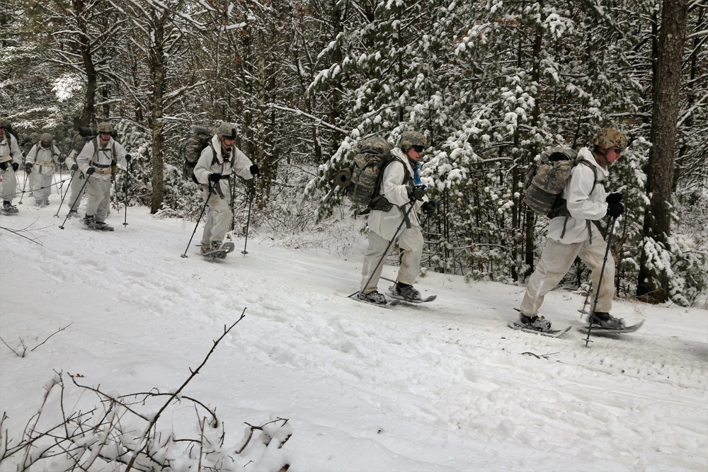 Cold-Weather Operations Course Class 18-06 students practice snowshoeing at Fort McCoy