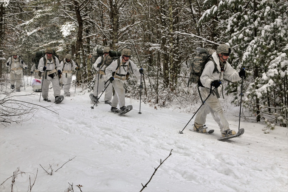 Cold-Weather Operations Course Class 18-06 students practice snowshoeing at Fort McCoy