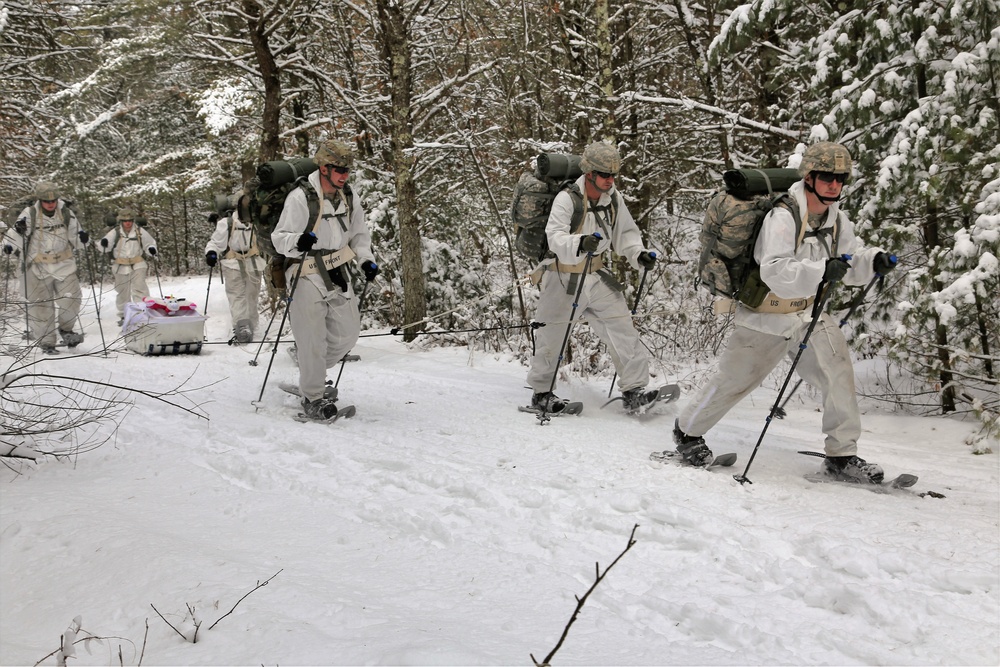 Cold-Weather Operations Course Class 18-06 students practice snowshoeing at Fort McCoy