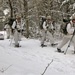 Cold-Weather Operations Course Class 18-06 students practice snowshoeing at Fort McCoy