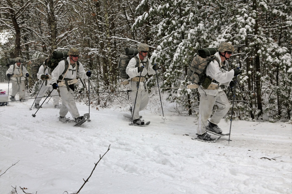 Cold-Weather Operations Course Class 18-06 students practice snowshoeing at Fort McCoy