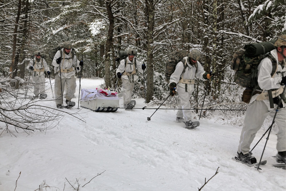 Cold-Weather Operations Course Class 18-06 students practice snowshoeing at Fort McCoy