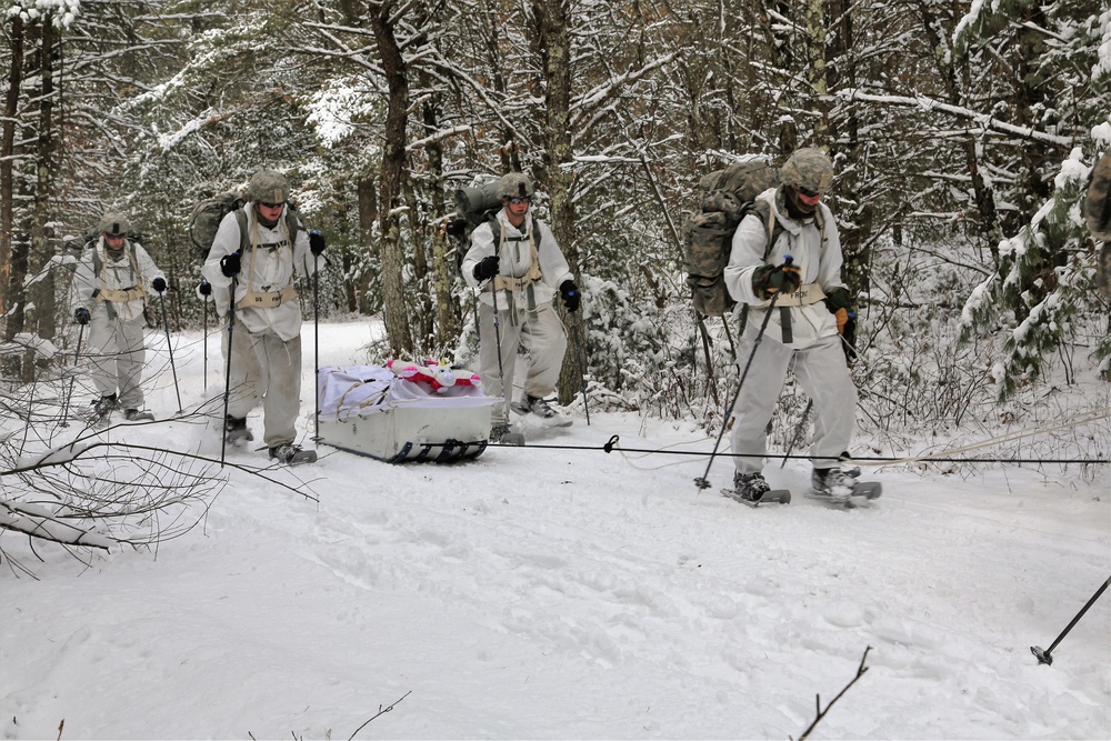 Cold-Weather Operations Course Class 18-06 students practice snowshoeing at Fort McCoy