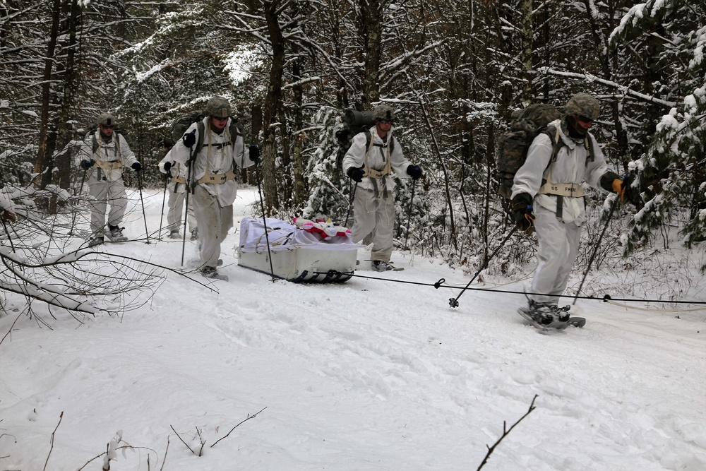 Cold-Weather Operations Course Class 18-06 students practice snowshoeing at Fort McCoy