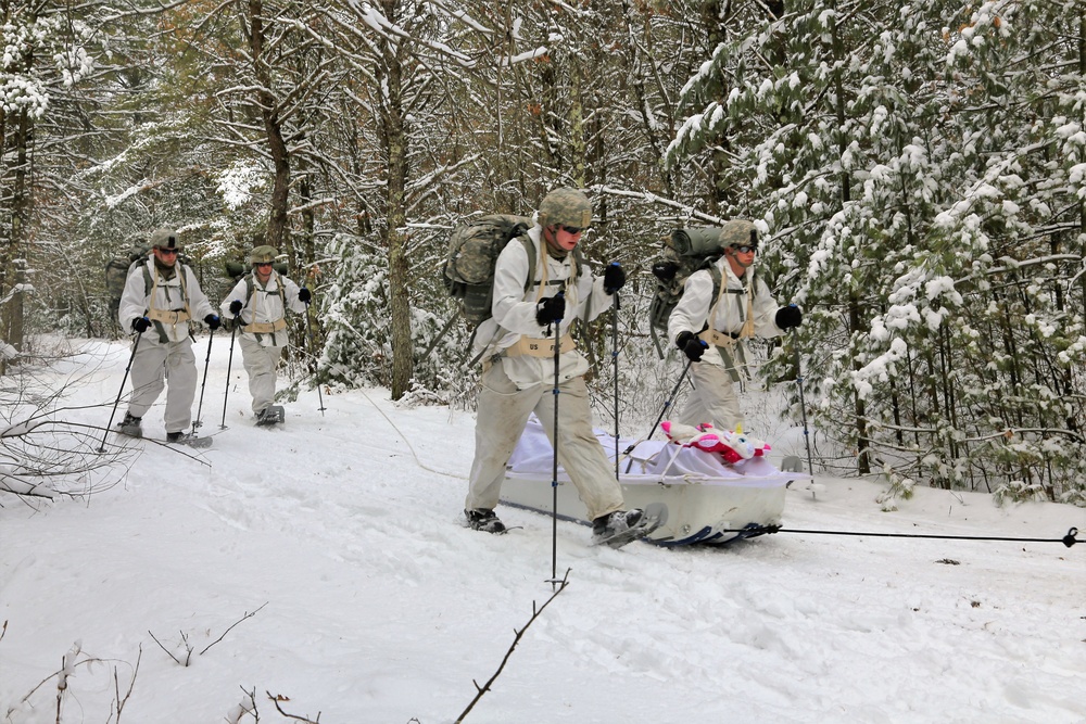 Cold-Weather Operations Course Class 18-06 students practice snowshoeing at Fort McCoy